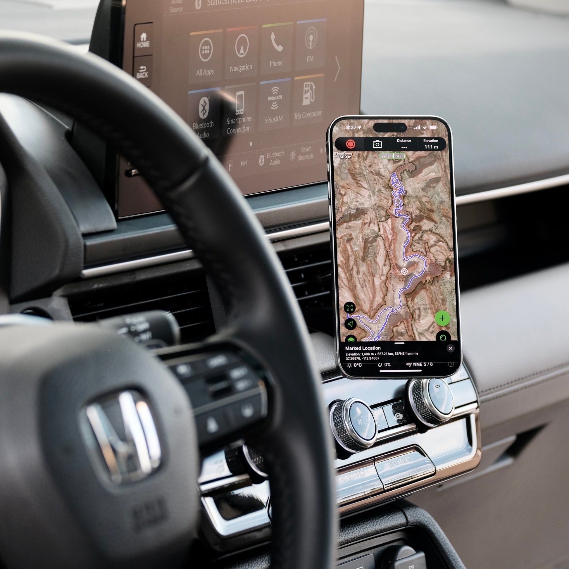 Image of Offroam MagSafe-compatible Phone Mount installed securely in Honda Pilot 2023-2025 | Passport 2026. This premium phone mount installs easily without drilling or glue. High force magnets hold phone on any trail, road, or track. Perfect placement without blocking screens, driver view, or air flow. Fully adjustable positioning.