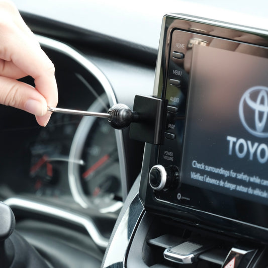 Image of Offroam Mounting Base installed securely in Toyota Corolla 2020-2026 | Corolla Cross 2022-2026. This premium all metal phone mounting base installs easily without drilling or glue. Perfect placement without blocking screens, driver view, or air flow.
