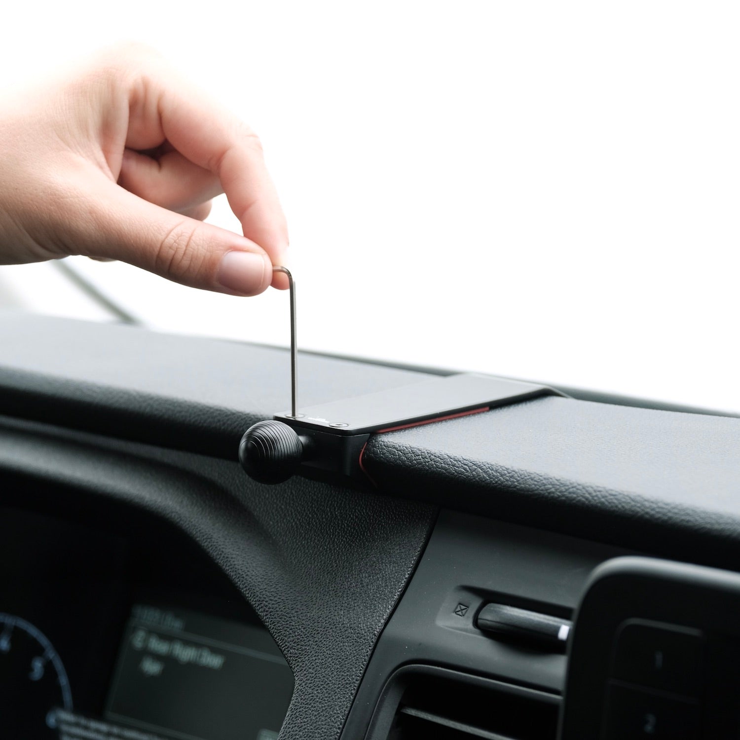 Image of Offroam Mounting Base installed securely in Ford Transit 2020-2026. This premium all metal phone mounting base installs easily without drilling or glue. Perfect placement without blocking screens, driver view, or air flow.