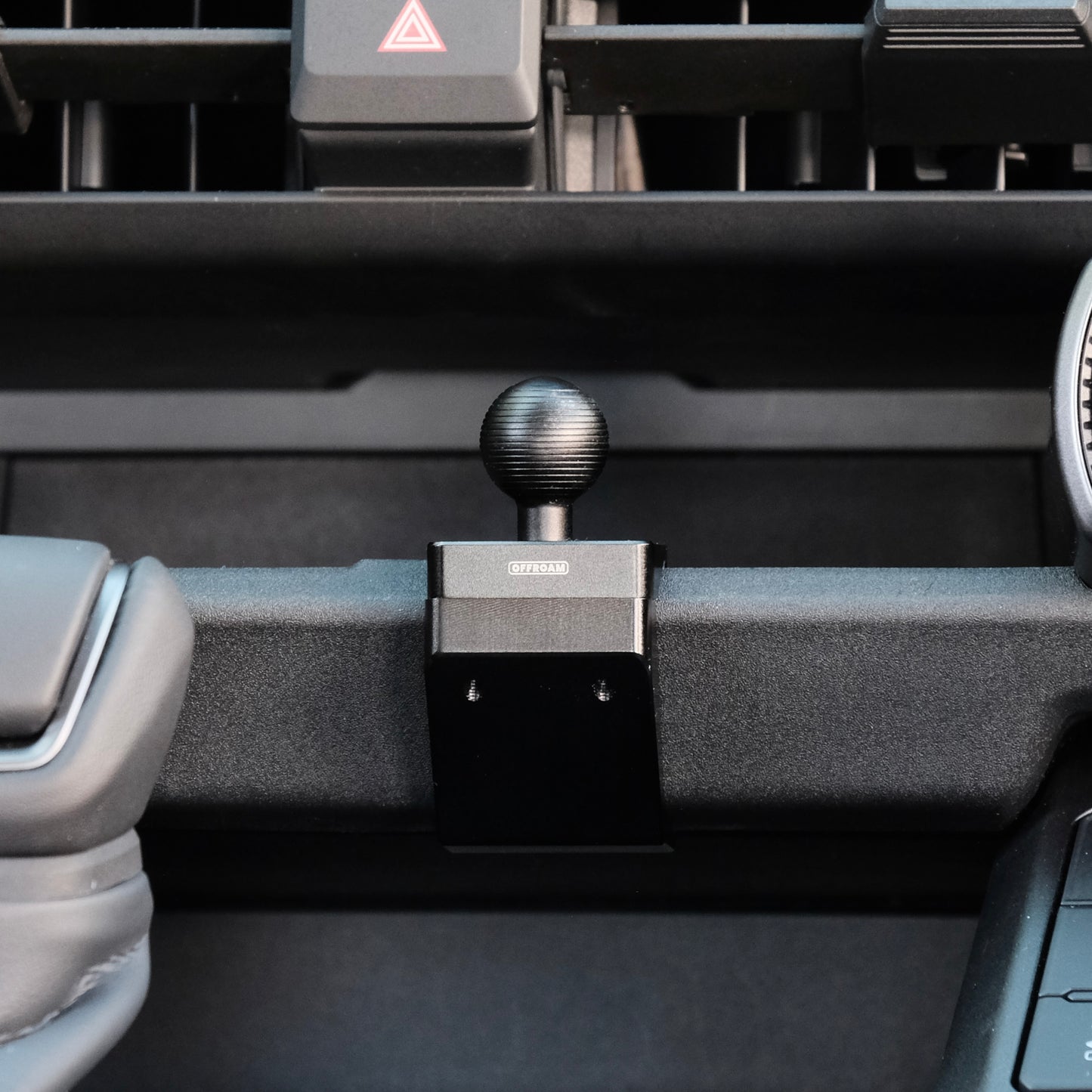 Image of Offroam Mounting Base installed securely in Toyota RAV4 2026, Center Console. This premium all metal phone mounting base installs easily without drilling or glue. Perfect placement without blocking screens, driver view, or air flow.