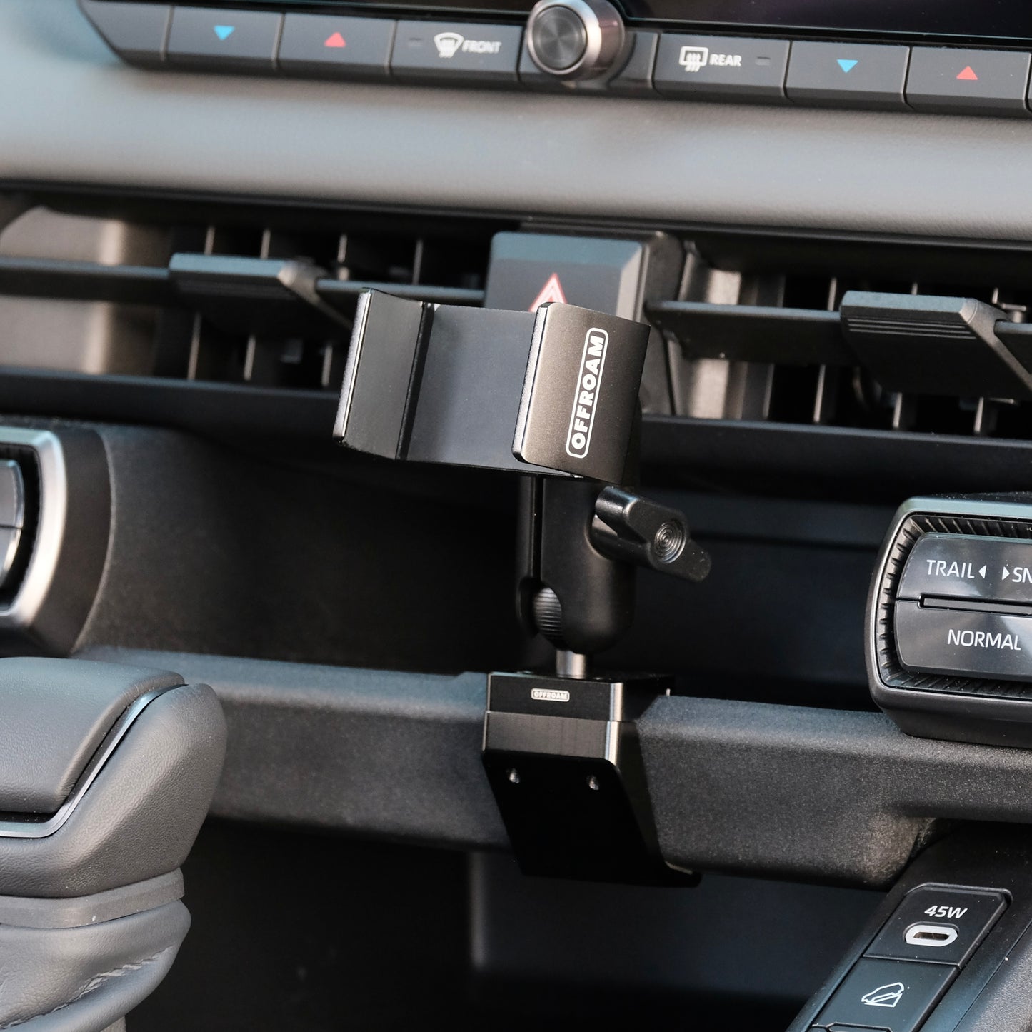 Image of Offroam Phone Mount installed securely in Toyota RAV4 2026. This premium phone mount installs easily without drilling or glue. Spring loaded Universal holder for use with any phone. Perfect placement without blocking screens, driver view, or air flow. Fully adjustable positioning.