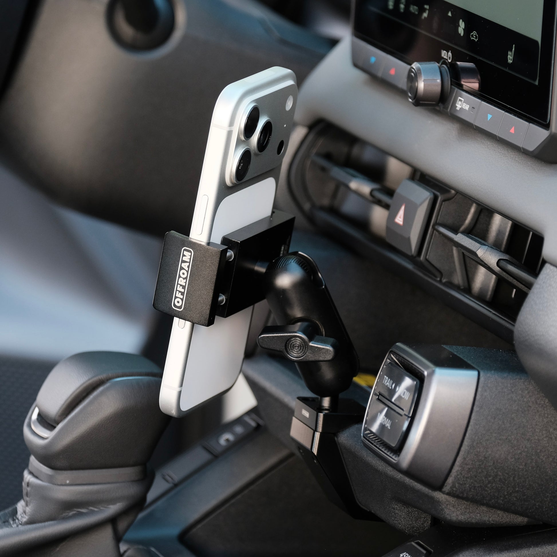 Image of Offroam Phone Mount installed securely in Toyota RAV4 2026. This premium phone mount installs easily without drilling or glue. Spring loaded Universal holder for use with any phone. Perfect placement without blocking screens, driver view, or air flow. Fully adjustable positioning.