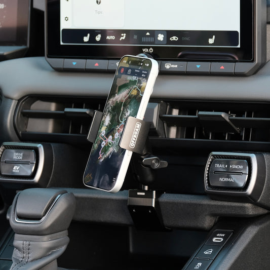 Image of Offroam Phone Mount installed securely in Toyota RAV4 2026. This premium phone mount installs easily without drilling or glue. Spring loaded Universal holder for use with any phone. Perfect placement without blocking screens, driver view, or air flow. Fully adjustable positioning.