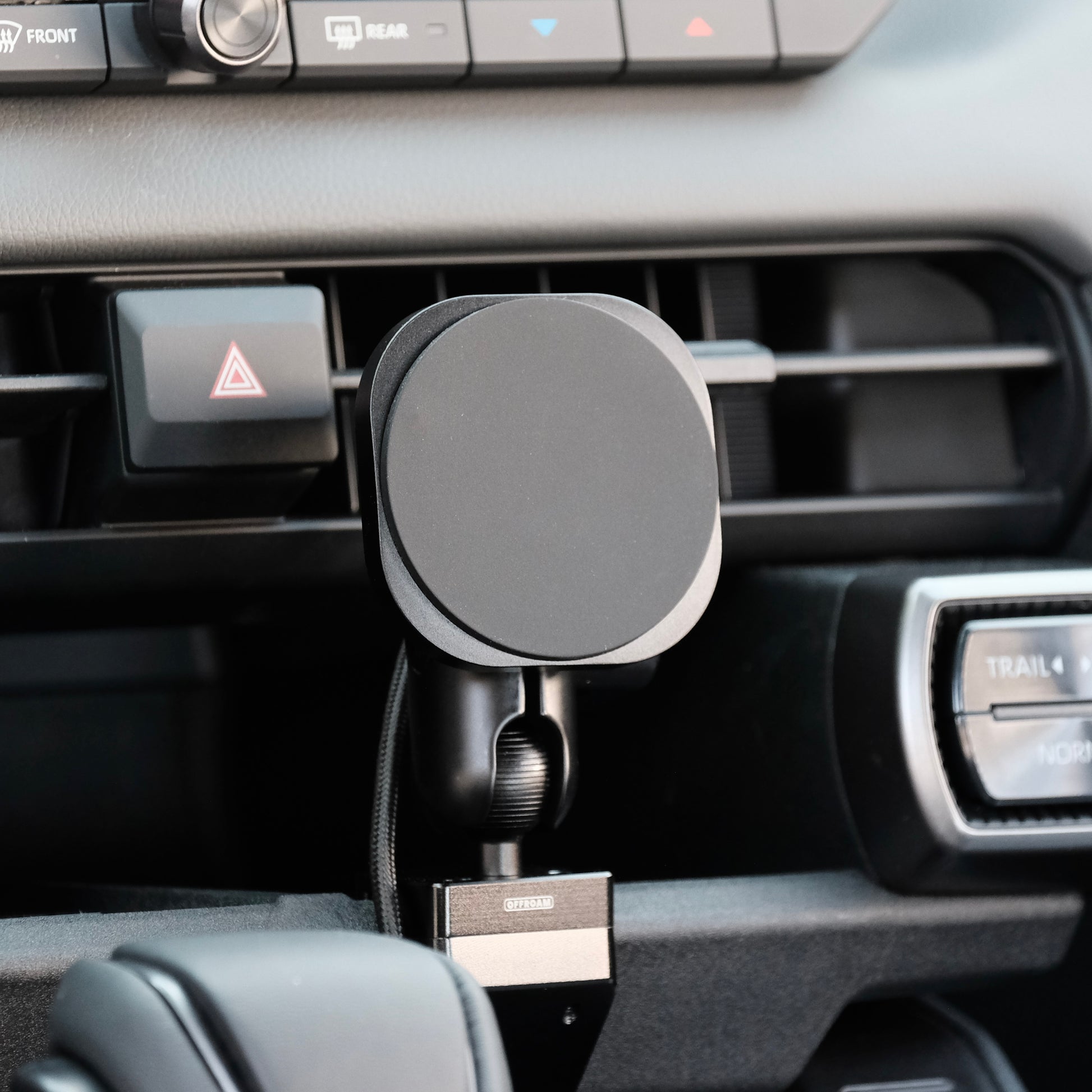 Image of Offroam MagSafe-compatible Phone Mount installed securely in Toyota RAV4 2026. This premium phone mount installs easily without drilling or glue. High force magnets hold phone on any trail, road, or track. Perfect placement without blocking screens, driver view, or air flow. Fully adjustable positioning.