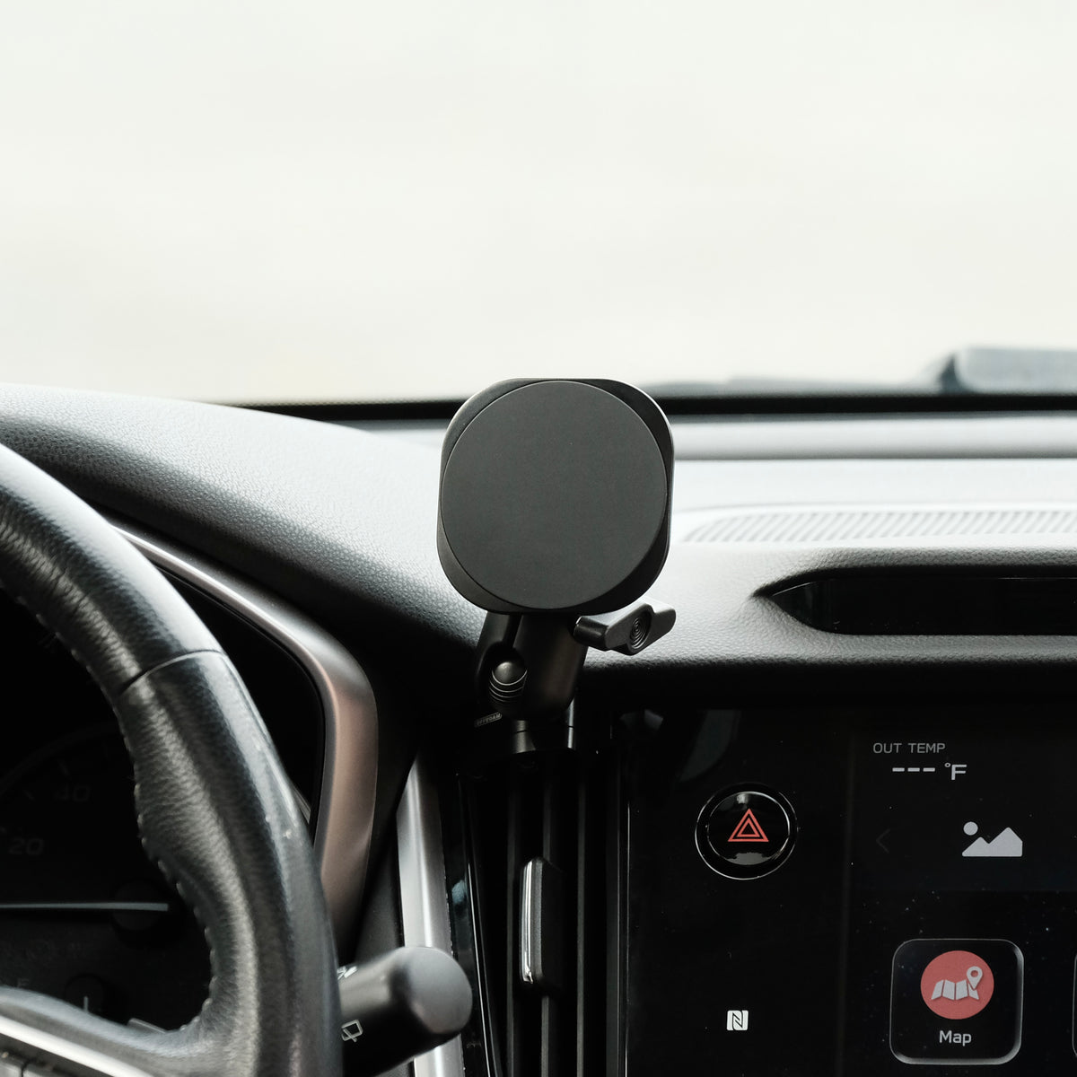 Image of Offroam MagSafe-compatible Phone Mount installed securely in Subaru Outback | Legacy 2020-2025. This premium phone mount installs easily without drilling or glue. High force magnets hold phone on any trail, road, or track. Perfect placement without blocking screens, driver view, or air flow. Fully adjustable positioning.