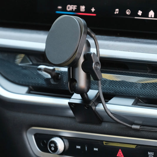 Image of Offroam MagSafe-compatible Phone Mount installed securely in BMW X5 2024-2026 | X6 2024-2027 | X7 2023-2027. This premium phone mount installs easily without drilling or glue. High force magnets hold phone on any trail, road, or track. Perfect placement without blocking screens, driver view, or air flow. Fully adjustable positioning.