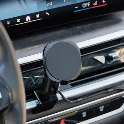 Image of Offroam MagSafe-compatible Phone Mount installed securely in BMW X5 2024-2026 | X6 2024-2027 | X7 2023-2027. This premium phone mount installs easily without drilling or glue. High force magnets hold phone on any trail, road, or track. Perfect placement without blocking screens, driver view, or air flow. Fully adjustable positioning.