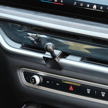 Image of Offroam Mounting Base installed securely in BMW X5 2024-2026 | X6 2024-2027 | X7 2023-2027. This premium all metal phone mounting base installs easily without drilling or glue. Perfect placement without blocking screens, driver view, or air flow.