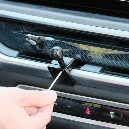 Image of Offroam Phone Mount installation for BMW X5 2024-2026 | X6 2024-2027 | X7 2023-2027. This premium phone mount installs easily without drilling or glue. Spring loaded Universal holder for use with any phone. Perfect placement without blocking screens, driver view, or air flow. Fully adjustable positioning.