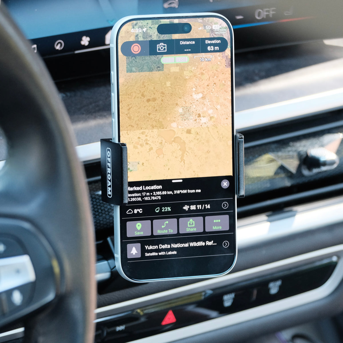 Image of Offroam Phone Mount installed securely in BMW X5 2024-2026 | X6 2024-2027 | X7 2023-2027. This premium phone mount installs easily without drilling or glue. Spring loaded Universal holder for use with any phone. Perfect placement without blocking screens, driver view, or air flow. Fully adjustable positioning.