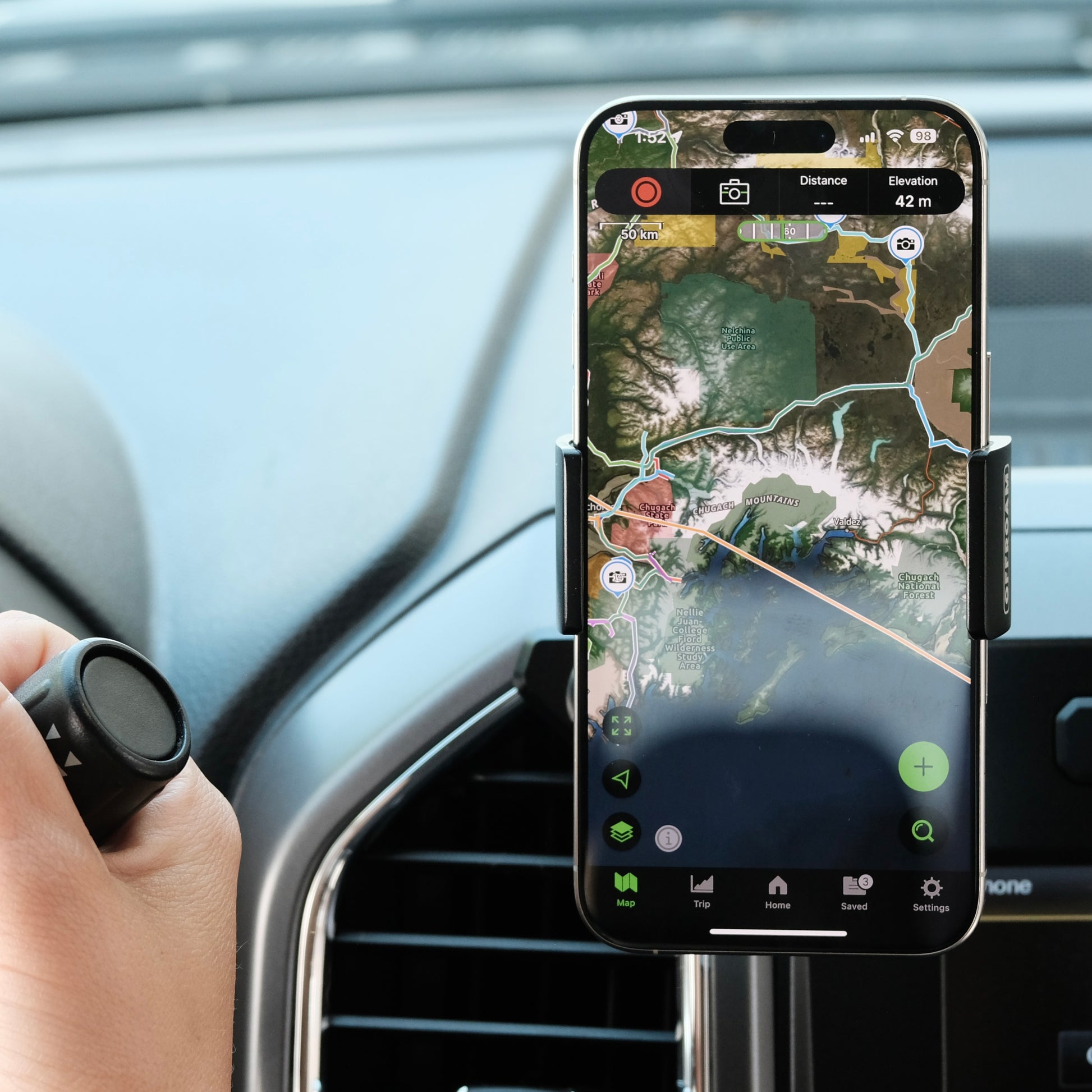Image of Offroam Phone Mount installed securely in Ford F-150 2015-2020 | Super Duty 2017-2021 & 2022 (XL and XLT) | Expedition 2018-2021. This premium phone mount installs easily without drilling or glue. Spring loaded Universal holder for use with any phone. Perfect placement without blocking screens, driver view, or air flow. Fully adjustable positioning.