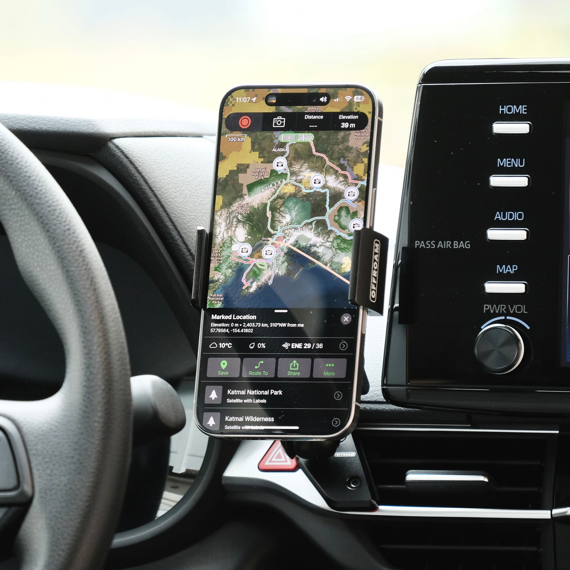 Image of Offroam Phone Mount installed securely in Toyota Sienna 2021-2026. This premium phone mount installs easily without drilling or glue. Spring loaded Universal holder for use with any phone. Perfect placement without blocking screens, driver view, or air flow. Fully adjustable positioning.