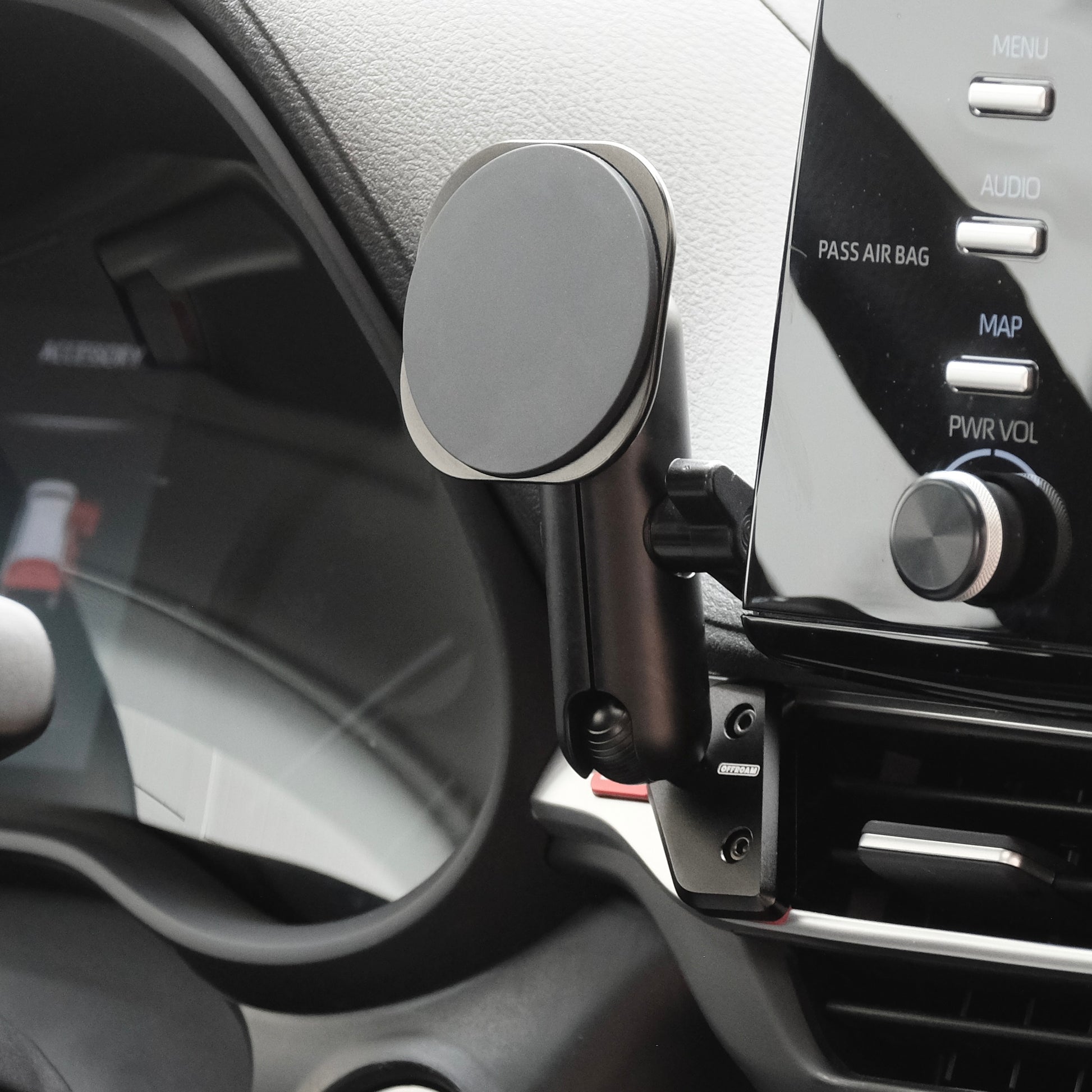 Image of Offroam MagSafe-compatible Phone Mount installed securely in Toyota Sienna 2021-2026. This premium phone mount installs easily without drilling or glue. High force magnets hold phone on any trail, road, or track. Perfect placement without blocking screens, driver view, or air flow. Fully adjustable positioning.