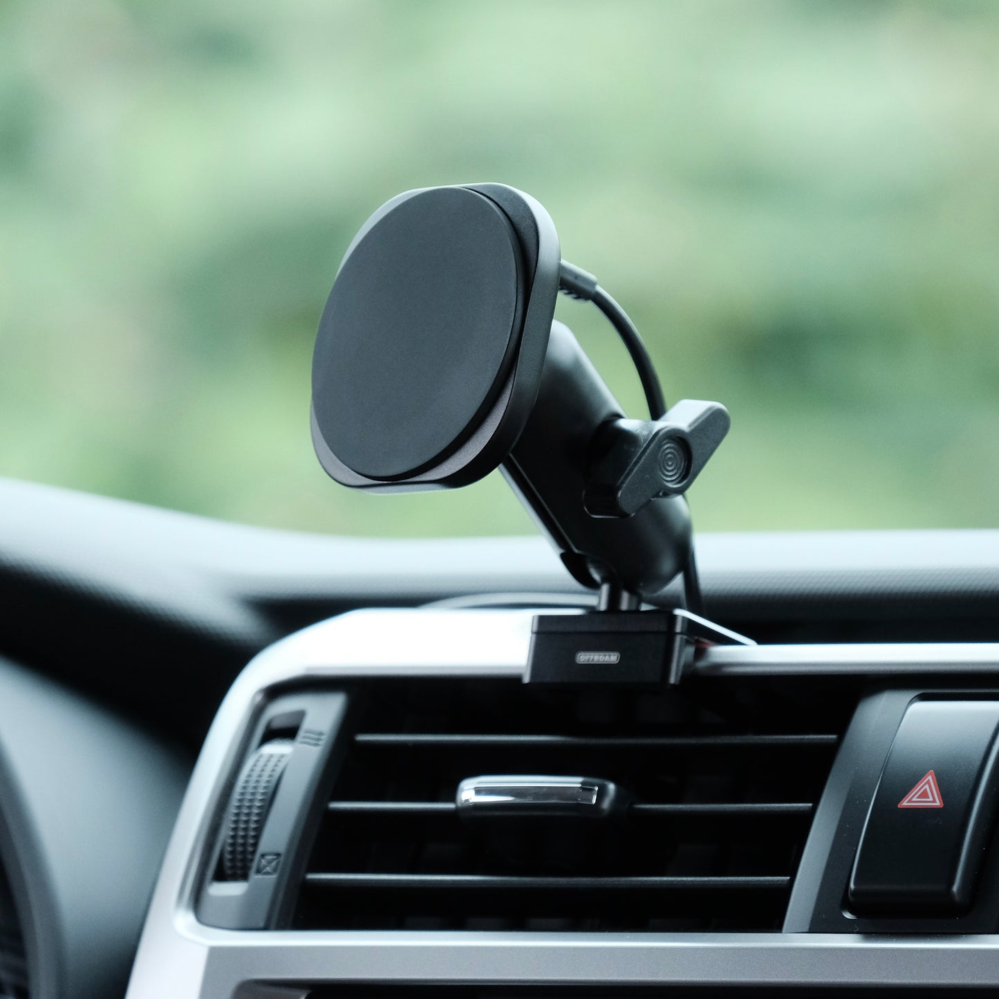 Image of Offroam MagSafe-compatible Phone Mount installed securely in Toyota 4Runner 2010-2024. This premium phone mount installs easily without drilling or glue. High force magnets hold phone on any trail, road, or track. Perfect placement without blocking screens, driver view, or air flow. Fully adjustable positioning.