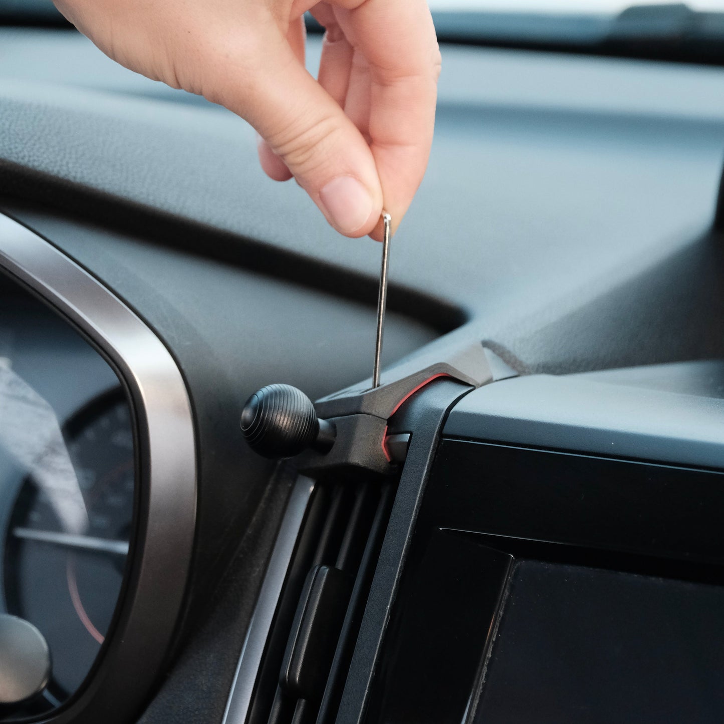 Image of Offroam Mounting Base installed securely in Subaru Crosstrek 2018-2023 | Forester 2019-2024| Impreza 2017-2023. This premium all metal phone mounting base installs easily without drilling or glue. Perfect placement without blocking screens, driver view, or air flow.