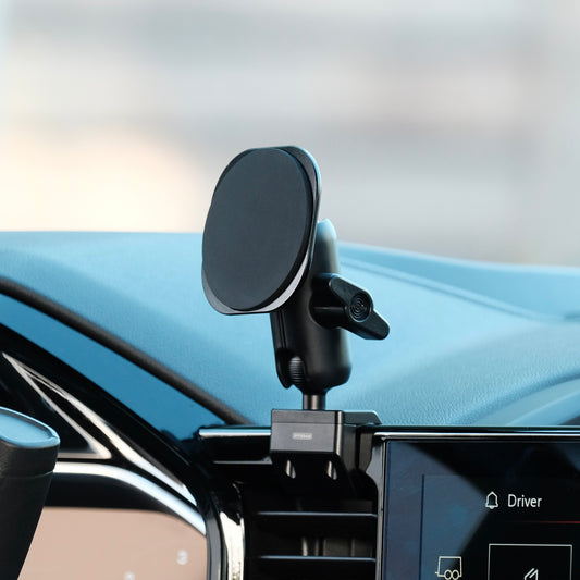 Image of Offroam MagSafe-compatible Phone Mount installed securely in Chevrolet Silverado 2022-2026 | Silverado HD 2024-2026 | GMC Sierra 1500 2022-2026 | Sierra HD 2024-2026 with 13.4-in. display. This premium phone mount installs easily without drilling or glue. High force magnets hold phone on any trail, road, or track. Perfect placement without blocking screens, driver view, or air flow. Fully adjustable positioning.