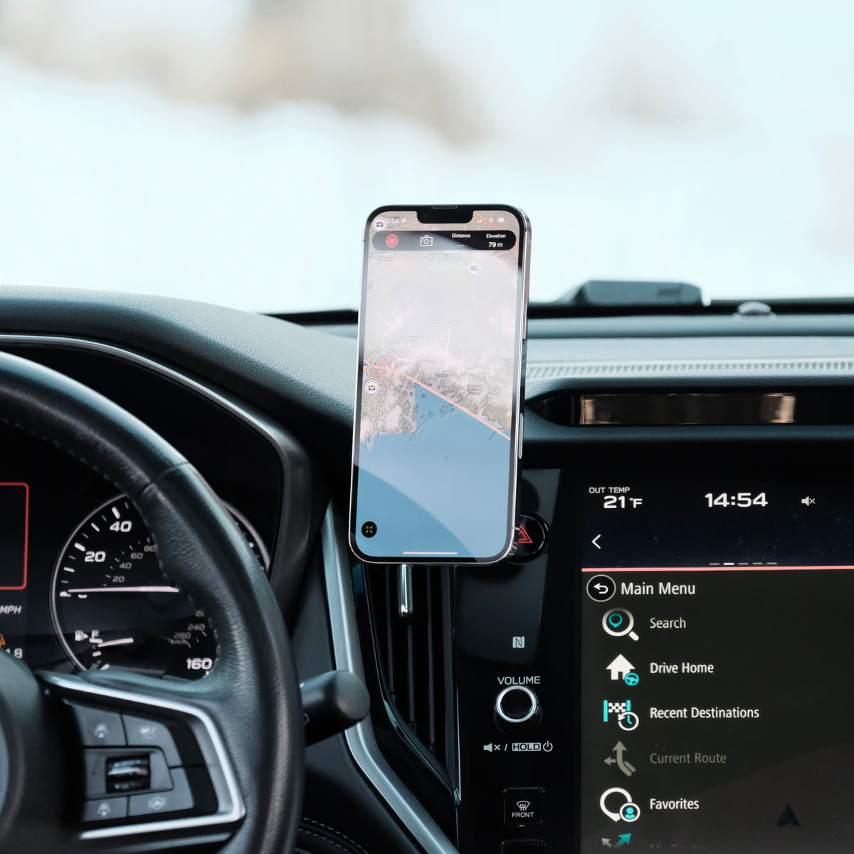 Image of Offroam MagSafe-compatible Phone Mount installed securely in Subaru Outback | Legacy 2020-2025. This premium phone mount installs easily without drilling or glue. High force magnets hold phone on any trail, road, or track. Perfect placement without blocking screens, driver view, or air flow. Fully adjustable positioning.