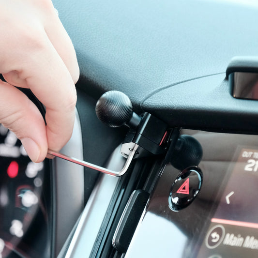 Image of Offroam Mounting Base installed securely in Subaru Outback | Legacy 2020-2025. This premium all metal phone mounting base installs easily without drilling or glue. Perfect placement without blocking screens, driver view, or air flow.