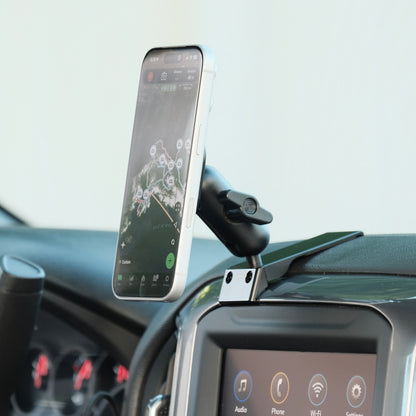 Image of Offroam MagSafe-compatible Phone Mount installed securely in Chevrolet Silverado 2019-2026 | Silverado HD 2020-2026 & GMC Sierra 1500 2019-2026 | Sierra HD 2020-2026 with 7-in.|8-in. display. This premium phone mount installs easily without drilling or glue. High force magnets hold phone on any trail, road, or track. Perfect placement without blocking screens, driver view, or air flow. Fully adjustable positioning.