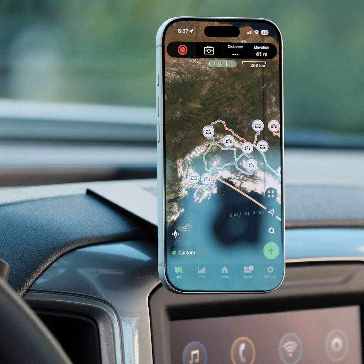 Image of Offroam MagSafe-compatible Phone Mount installed securely in Chevrolet Silverado 2019-2026 | Silverado HD 2020-2026 & GMC Sierra 1500 2019-2026 | Sierra HD 2020-2026 with 7-in.|8-in. display. This premium phone mount installs easily without drilling or glue. High force magnets hold phone on any trail, road, or track. Perfect placement without blocking screens, driver view, or air flow. Fully adjustable positioning.