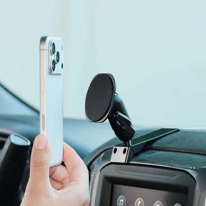 Image of Offroam MagSafe-compatible Phone Mount installed securely in Chevrolet Silverado 2019-2026 | Silverado HD 2020-2026 & GMC Sierra 1500 2019-2026 | Sierra HD 2020-2026 with 7-in.|8-in. display. This premium phone mount installs easily without drilling or glue. High force magnets hold phone on any trail, road, or track. Perfect placement without blocking screens, driver view, or air flow. Fully adjustable positioning.