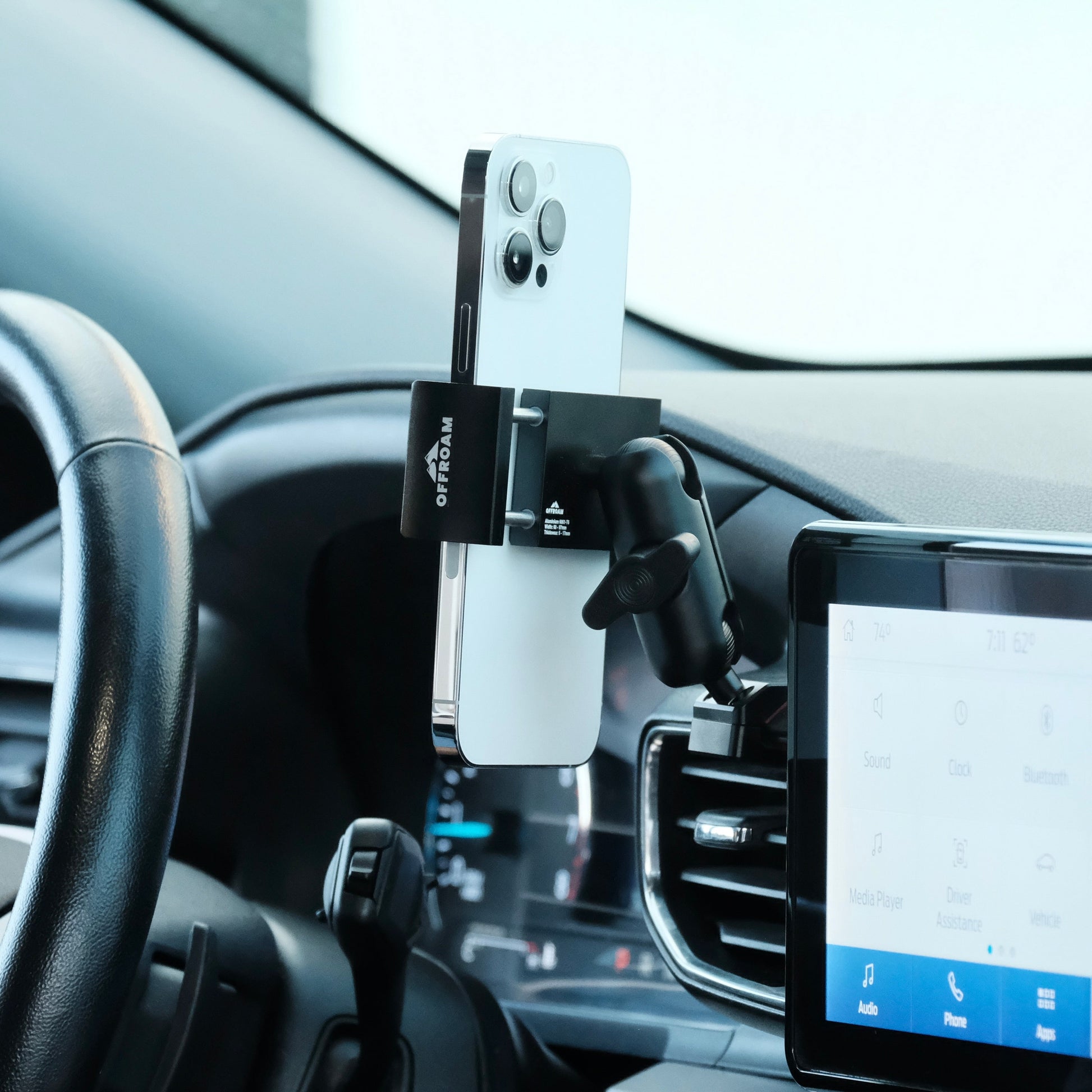 Image of Offroam Phone Mount installed securely in Ford Explorer 2020-2024. This premium phone mount installs easily without drilling or glue. Spring loaded Universal holder for use with any phone. Perfect placement without blocking screens, driver view, or air flow. Fully adjustable positioning.