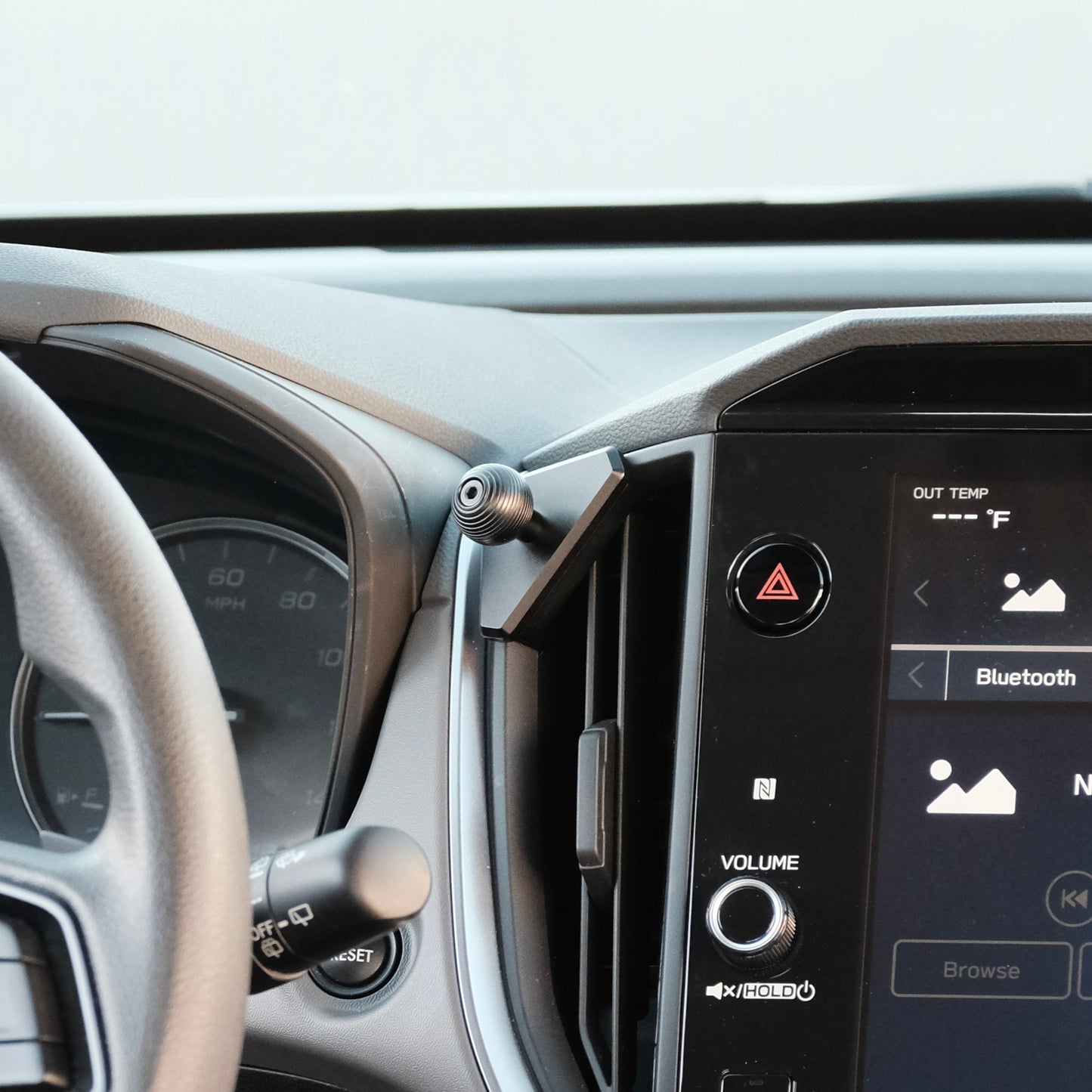 Image of Offroam Mounting Base installed securely in Subaru Crosstrek 2024-2026 | Impreza 2024-2026 | WRX 2022-2026. This premium all metal phone mounting base installs easily without drilling or glue. Perfect placement without blocking screens, driver view, or air flow.