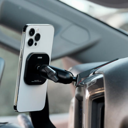 Image of Offroam MagSafe-compatible Phone Mount installed securely in Chevrolet Silverado 2019-2026 | Silverado HD 2020-2026 & GMC Sierra 1500 2019-2026 | Sierra HD 2020-2026 with 7-in.|8-in. display. This premium phone mount installs easily without drilling or glue. High force magnets hold phone on any trail, road, or track. Perfect placement without blocking screens, driver view, or air flow. Fully adjustable positioning.
