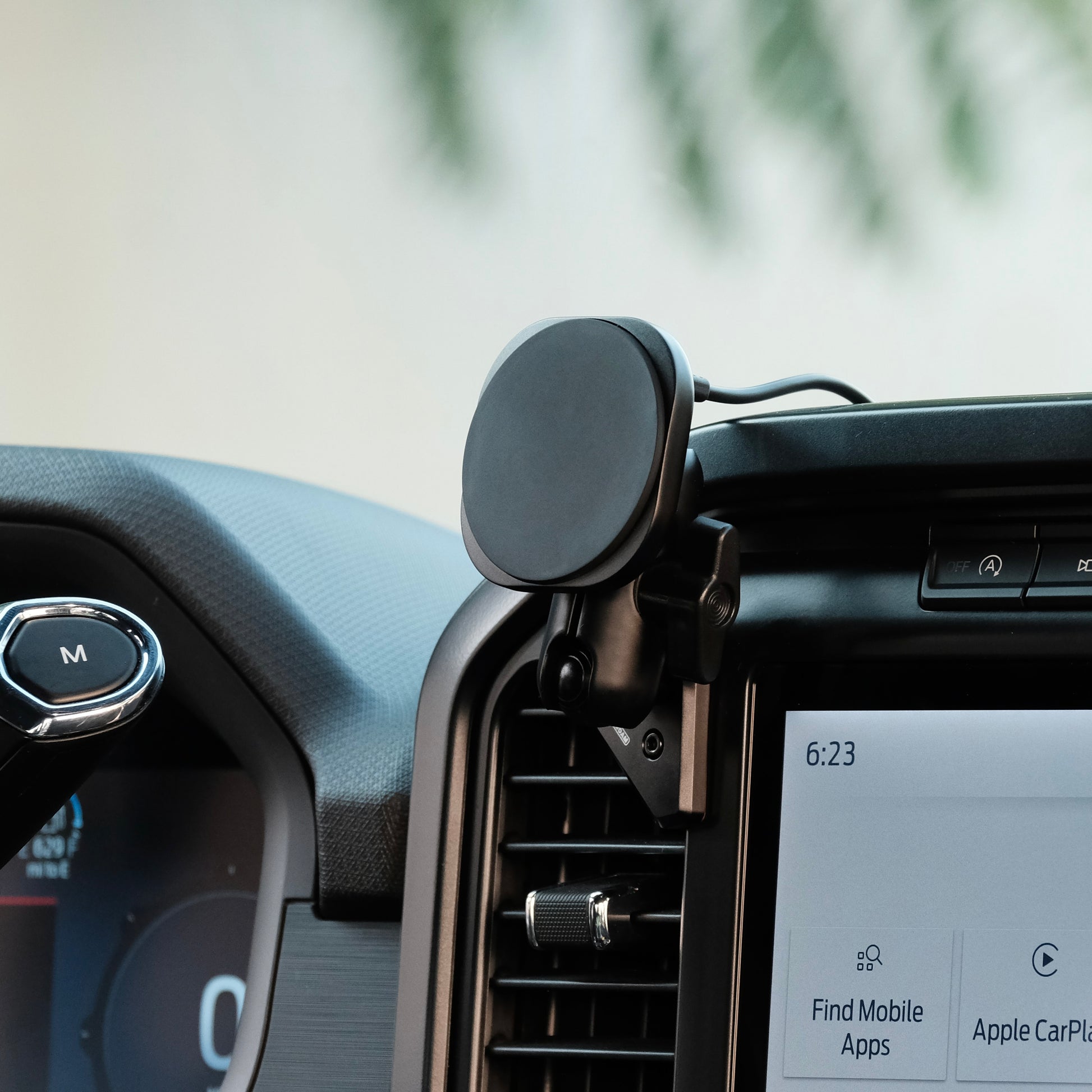 Image of Offroam MagSafe-compatible Phone Mount installed securely in Ford F-150 2021-2025 | F-250/F-350 2023-2025 | F-150 Lightning (XL & PRO) 2022-2025. This premium phone mount installs easily without drilling or glue. High force magnets hold phone on any trail, road, or track. Perfect placement without blocking screens, driver view, or air flow. Fully adjustable positioning.
