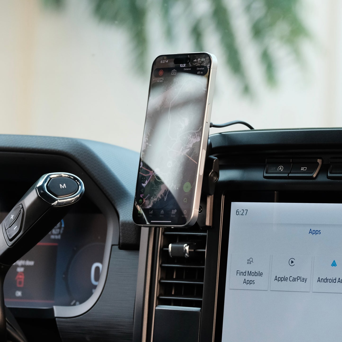Image of Offroam MagSafe-compatible Phone Mount installed securely in Ford F-150 2021-2025 | F-250/F-350 2023-2025 | F-150 Lightning (XL & PRO) 2022-2025. This premium phone mount installs easily without drilling or glue. High force magnets hold phone on any trail, road, or track. Perfect placement without blocking screens, driver view, or air flow. Fully adjustable positioning.