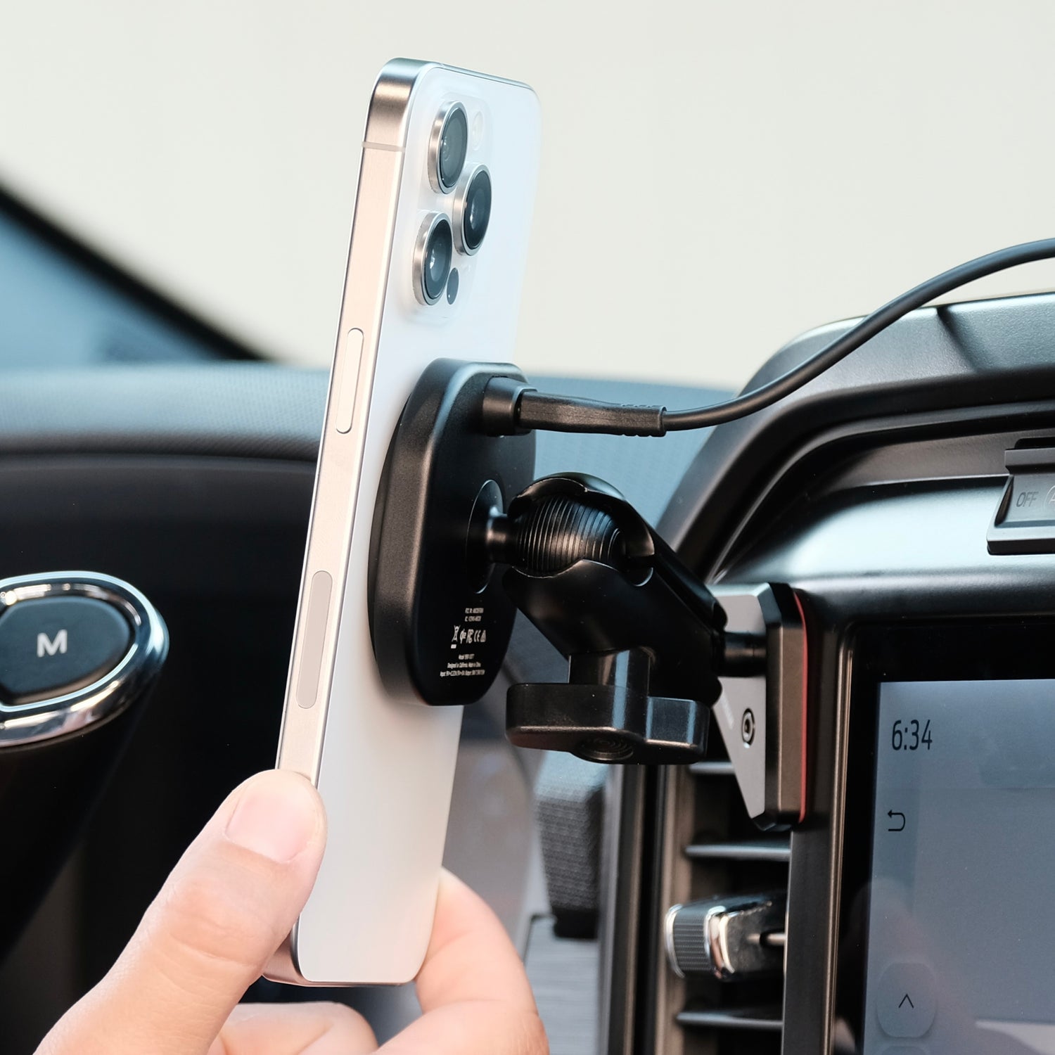 Image of Offroam MagSafe-compatible Phone Mount installed securely in Ford F-150 2021-2025 | F-250/F-350 2023-2025 | F-150 Lightning (XL & PRO) 2022-2025. This premium phone mount installs easily without drilling or glue. High force magnets hold phone on any trail, road, or track. Perfect placement without blocking screens, driver view, or air flow. Fully adjustable positioning.