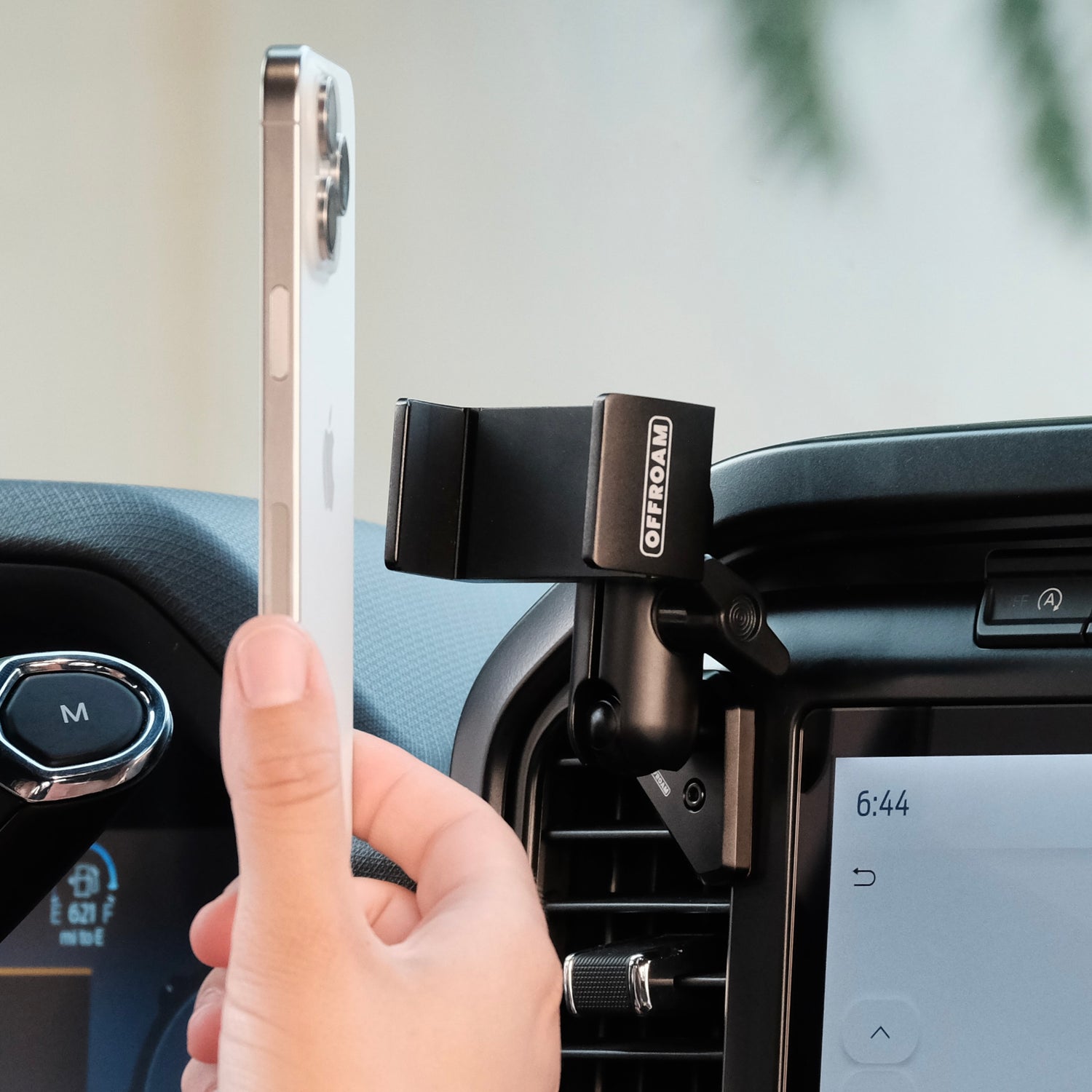 Image of Offroam Phone Mount installed securely in Ford F-150 2021-2026 | F-250/F-350 2023-2026 | F-150 Lightning (XL & PRO) 2022-2026. This premium phone mount installs easily without drilling or glue. Spring loaded Universal holder for use with any phone. Perfect placement without blocking screens, driver view, or air flow. Fully adjustable positioning.