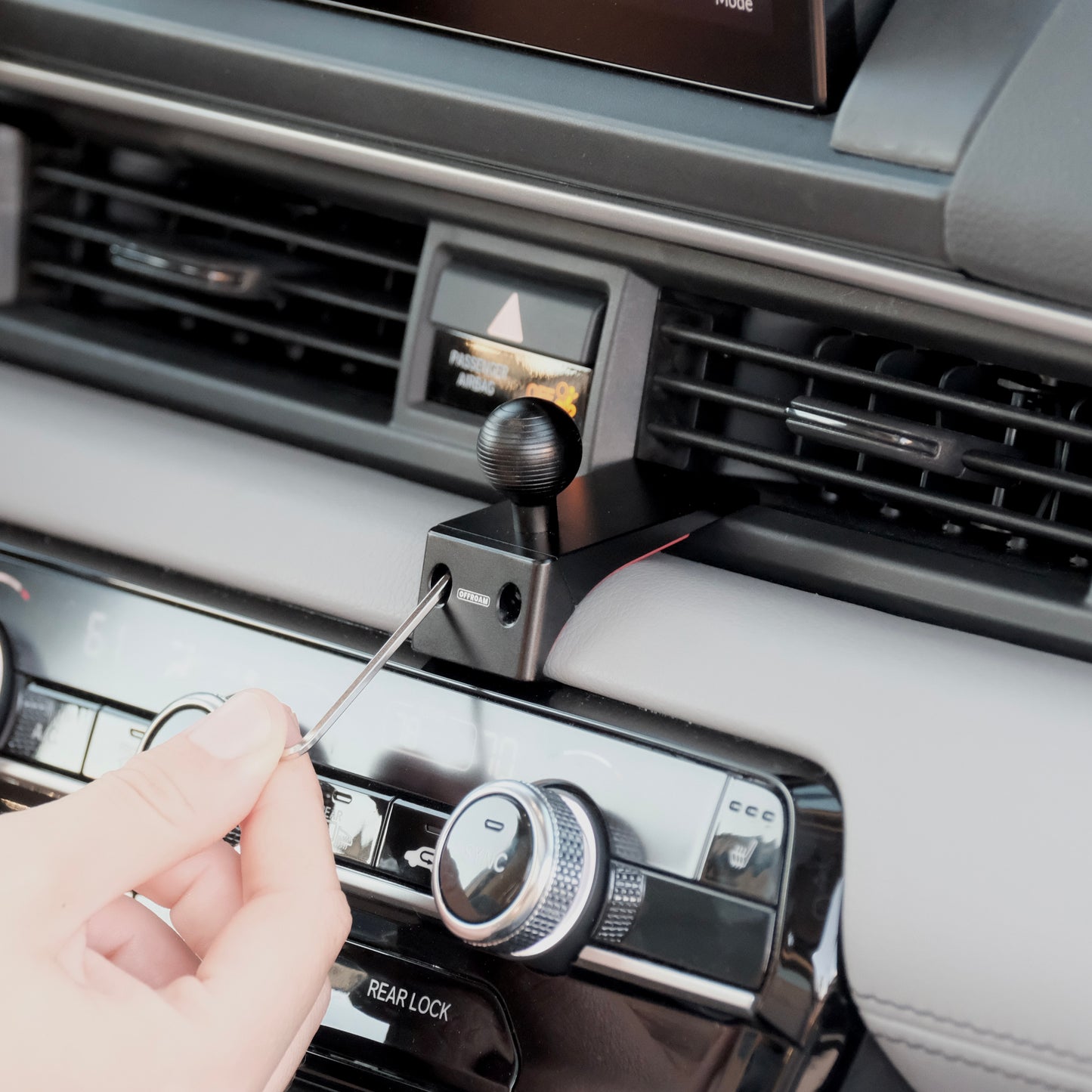 Image of Offroam Mounting Base installed securely in Honda Pilot 2023-2026 | Passport 2026. This premium all metal phone mounting base installs easily without drilling or glue. Perfect placement without blocking screens, driver view, or air flow.