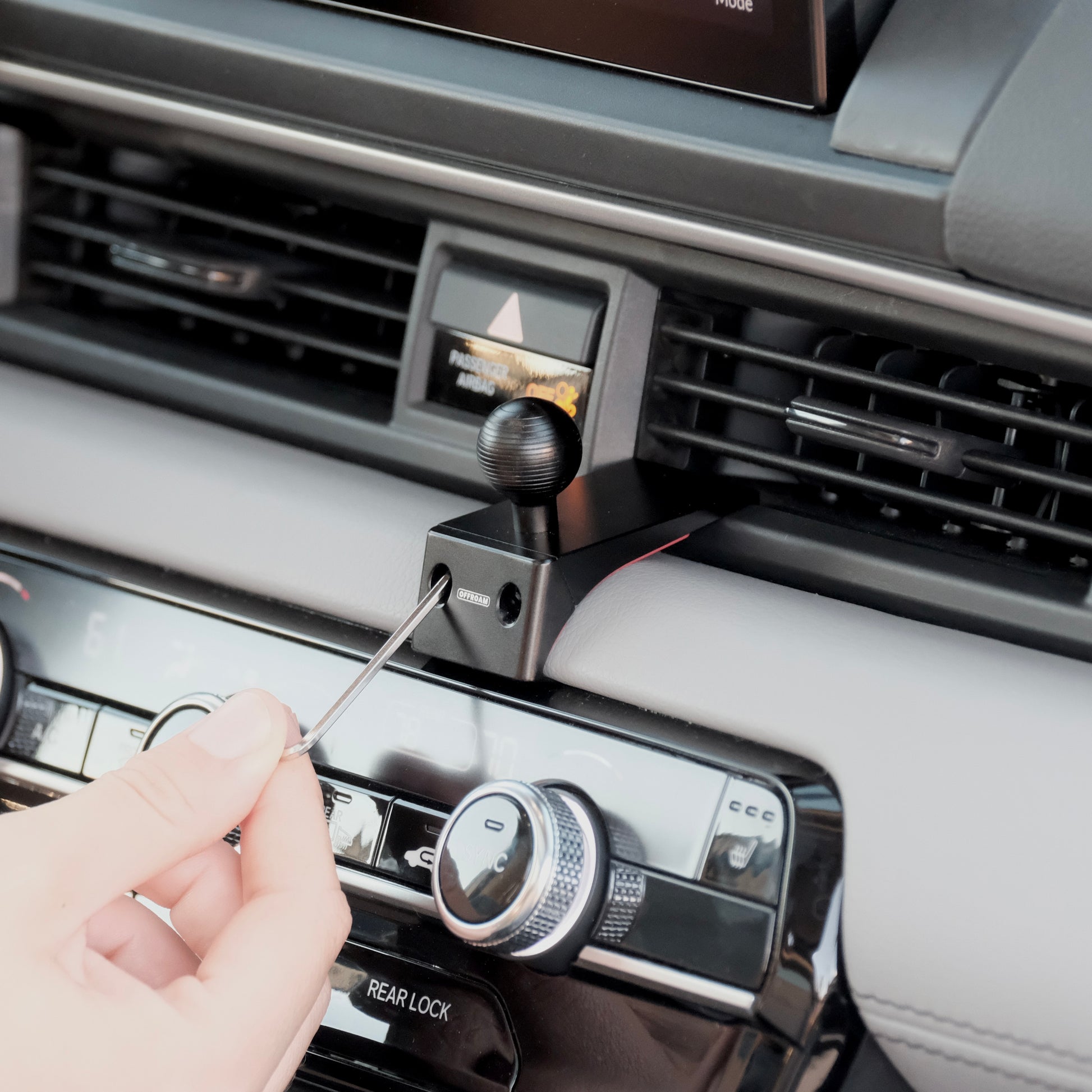 Image of Offroam Mounting Base installed securely in Honda Pilot 2023-2026 | Passport 2026. This premium all metal phone mounting base installs easily without drilling or glue. Perfect placement without blocking screens, driver view, or air flow.