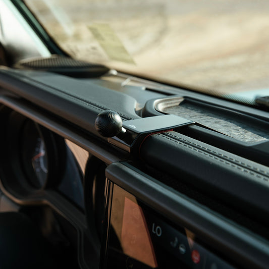 A premium accessory phone mount for Jeep Wrangler Gladiator 2024-2025 is that allows to securely mount phone. Shown on installed on the dashboard with 20mm ball interface.