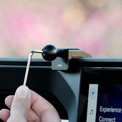 Image of Offroam Mounting Base installed securely in Toyota Land Cruiser 250 2024-2025. This premium all metal phone mounting base installs easily without drilling or glue. Perfect placement without blocking screens, driver view, or air flow.