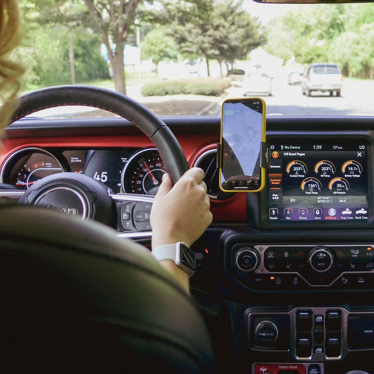 Image of Offroam Phone Mount installed securely in Jeep Wrangler 2018-2023 | Gladiator 2019-2023. This premium phone mount installs easily without drilling or glue. Spring loaded Universal holder for use with any phone. Perfect placement without blocking screens, driver view, or air flow. Fully adjustable positioning.