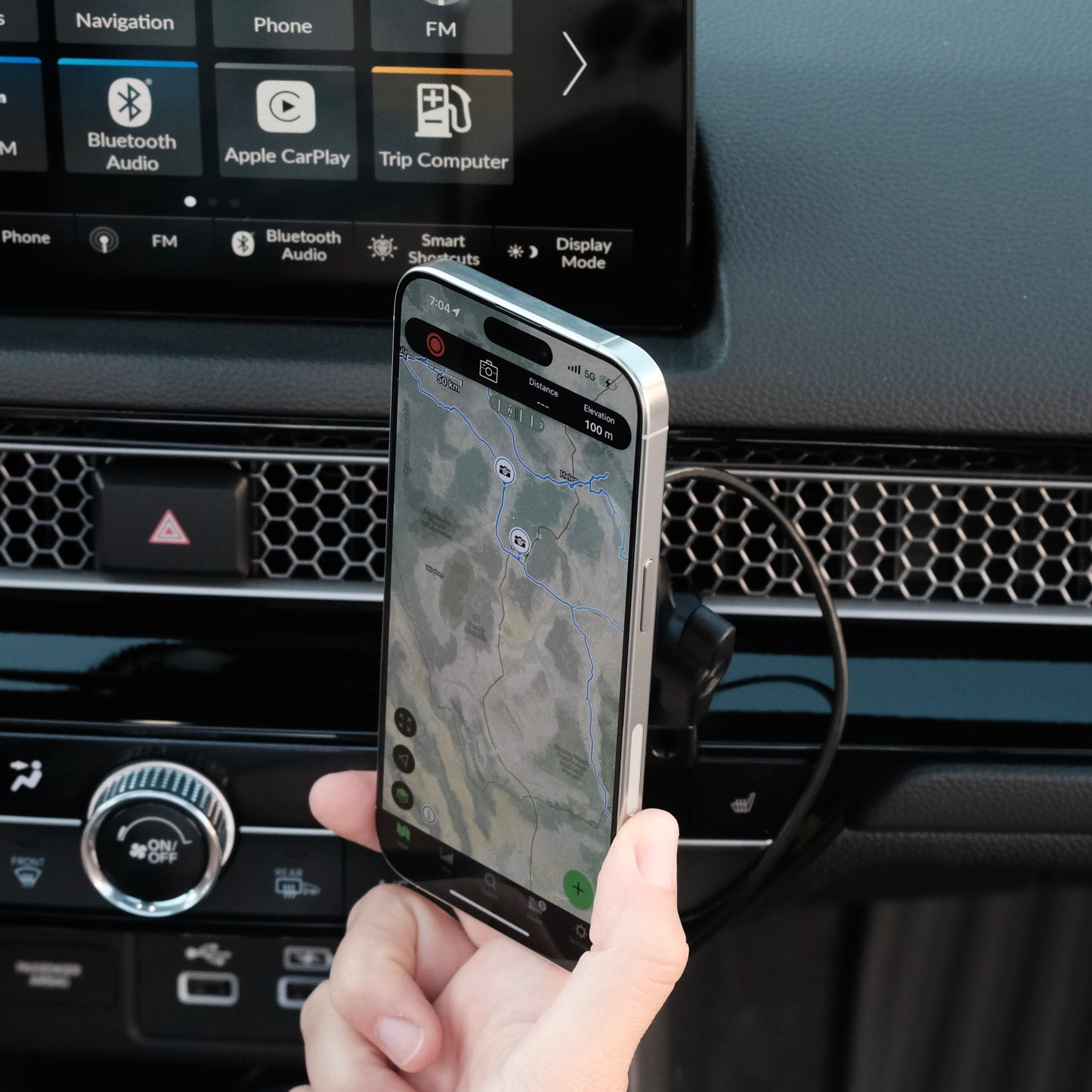 Image of Offroam MagSafe-compatible Phone Mount installed securely in Honda Civic 2022-2026 | CR-V 2023-2026. This premium phone mount installs easily without drilling or glue. High force magnets hold phone on any trail, road, or track. Perfect placement without blocking screens, driver view, or air flow. Fully adjustable positioning.
