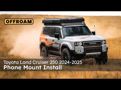 Video of Offroam Phone Mount installation for Toyota Land Cruiser 250 2024-2025. This premium phone mount installs easily without drilling or glue. Spring loaded Universal holder for use with any phone. Perfect placement without blocking screens, driver view, or air flow. Fully adjustable positioning.